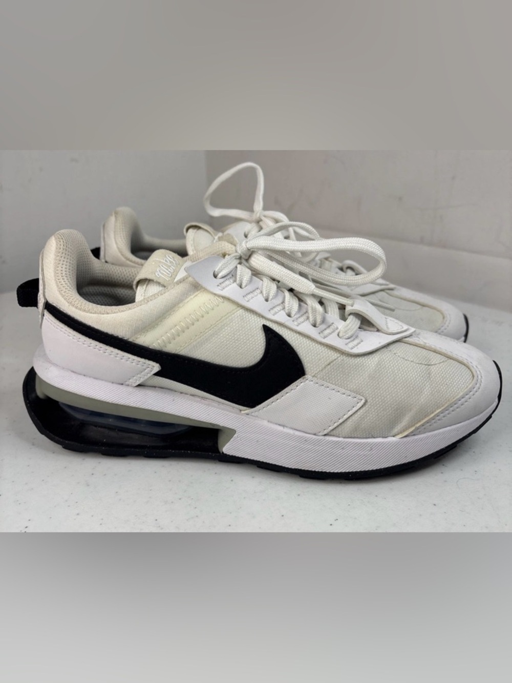 Nike Cream and Black Low-Top Swoosh Sneakers